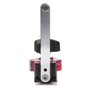 Front view of the Lincoln Manual Hand Lifter K3311-1, featuring a silver horizontal bar, black handle, and red circular base. Used for safety lockout procedures in industrial settings; partially visible warning labels.
