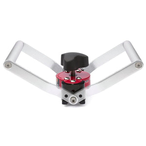 The Lincoln Manual Hand Lifter K3311-1 features two silver handles, a central red and black circular clamp, and a black turning knob. Shown from the front against a white background, it is designed to grip and easily open jar lids.