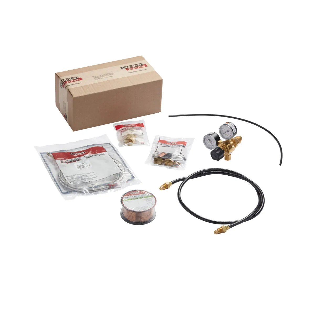 The Lincoln MIG Conversion Kit K610-1 is shown with a cardboard box, copper wire spool, black hose with brass connectors, dual-gauge regulator, and sealed bags of MIG welding accessories, all neatly arranged on a white background.