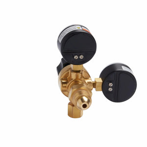 The Lincoln MIG Conversion Kit K610-2 features a brass gas regulator with two round black pressure gauges, a front nozzle, and a hexagonal base nut. Shown on a plain white background, it’s ideal for MIG welding setups.