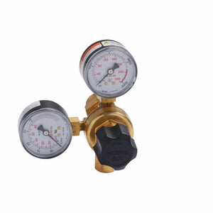A brass gas pressure regulator for MIG welding features two round red-and-black gauges and a black “HARRIS 601” adjustment knob. It is compatible with the Lincoln MIG Conversion Kit K610-2 and shown against a white background.