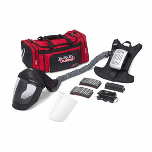 Lincoln OMNIShield XC PAPR K5323-2 welding respirator kit with face shield, filters, harness, charger, and bag on white background.