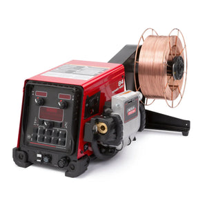 A Lincoln Power Feed 84 Std. Dty Reel One-Pak K3328-7, finished in red and black, features control knobs, switches, digital displays, and a mounted copper welding wire spool. The semiautomatic wire feeder is shown against a white background.