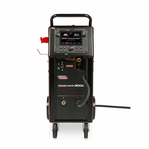 The Lincoln Power Wave 300C Standard - K4487-1 multi-process welding machine is shown from the front, featuring a display screen, waveform control panel, cable ports, connector, branded labels, and a power cable extending on the right.