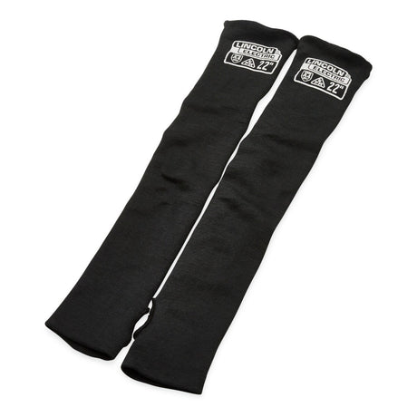 The Lincoln Premium A4 Cut Resistant FR Welding Sleeves K4890-ALL are a pair of black para-aramid sleeves, 22 inches long with slotted thumbs, stretch-fit cuffs and LINCOLN ELECTRIC labels.