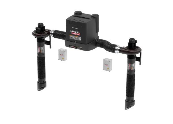 A Lincoln Prism Dual Arm Wall Mount with MERV 14 Filter (K4261-13) is mounted on a horizontal pipe with two vertical support arms, resembling a wall-mounted fume extractor. Two white control boxes sit below. The background is plain white.