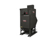 A large, black Lincoln Prism® Compact (5 HP 2400 CFM) fume extraction unit, model AD2455-1, stands on a metal frame. It features a control panel and four vertical filters for advanced heavy-duty industrial fume removal.