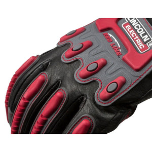 A close-up of the Lincoln Roll Cage Welding Rigging Gloves XL K3109-XL in black and red, featuring reinforced knuckle protection, textured grip areas, visible stitching, and Lincoln Electric Red Line branding on the back.