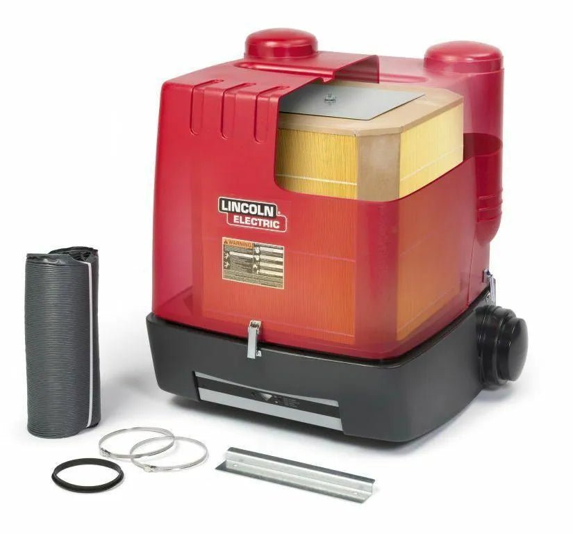 A red and black Lincoln STATIFLEX 200-M SINGLE ARM K1654-1 wall-mounted welding fume extractor with a visible gold filter is shown. Accessories—a black cylindrical roll, metal rings, flat metal piece, and rubber ring—are displayed beside it on a white background.