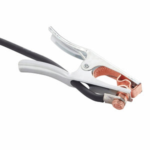 A close-up of a metal alligator clamp with copper contacts attached to a welding cable, commonly used as a grounding clamp for welding or automotive batteries.