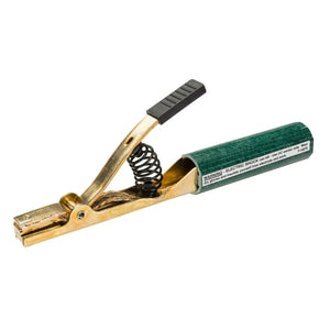 A close-up of a Lincoln T300 Electrode Holder with a green insulated handle, black grip, and exposed metal clamp with spring mechanism. A warning label is visible on this 300A electrode holder used for DC welders.