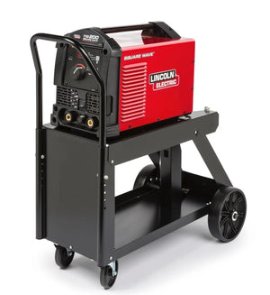 A red Lincoln Electric Square Wave TIG 200 welding machine sits on a black gas cylinder cart with an adjustable handle, storage shelf, and two large rear wheels, perfect for organizing welding accessories.