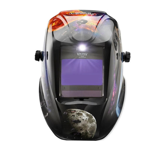 A black welding helmet with a large viewing window, space-themed graphics, and “Viking” logo. Compatible with the Lincoln VIKING 2450 ADV LED Light Kit - KP5245-1 for better visibility, it features dual side adjustment knobs for comfort.