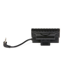 A black electronic device with a grooved top and built-in clip, resembling a part from the Lincoln VIKING 2450 ADV Series Intergalactic Welding Helmet (K5243-5), features a short cable with a right-angle 3.5mm jack, set on a plain white background.