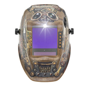 The Lincoln VIKING 3350 ADV Steampunk Welding Helmet - K3428-5 boasts a vibrant steampunk design with gears and pipes, an auto-darkening lens for clear visibility, side adjustment knobs for comfort, and a bright light at the lens top.