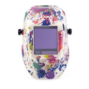 The Lincoln VIKING 3350 Creative Spark Welding Helmet (K5134-4) features a rectangular viewing window, adjustable side knobs, and a vibrant design with green, blue, pink, purple, and yellow paint splashes on a white background.