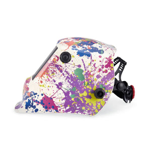 A side view of the Lincoln VIKING 3350 Creative Spark Welding Helmet (K5134-4) in white with colorful paint splatters, a dark 4C Lens Technology face shield, and an adjustable black and red head strap on a plain white background.