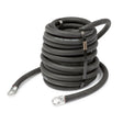 A coiled black 4/0 weld power cable with metal ring terminals on both ends, secured by two black straps, is placed on a white background.
