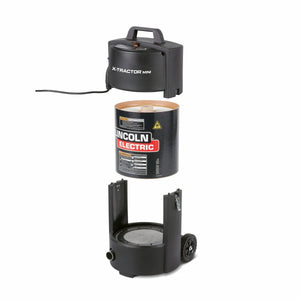 An exploded view of the Lincoln X-Tractor Mini (120/1/60) K3972-3 details three stacked parts: the top unit with power cord, a cylindrical filter, and a wheeled base with hose connector and round filter platform.