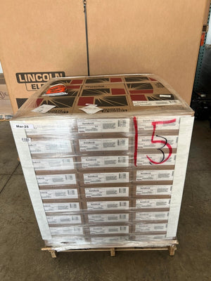 Lincoln ED030611 SureArc S6 .035 MIG welding wire 33 lb spools, 81-roll pallet wrapped in plastic in industrial warehouse.